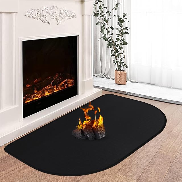 Una alfombrilla fina y negra de protección antichispas de fibra de vidrio recubierta de silicona, de 80 por 50 centímetros